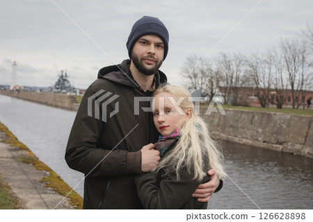 Elegant young woman with blond hair and handsome man outdoors. Happy couple Elegant young woman with blond hair and handsome man outdoors. Happy couple 126628898
