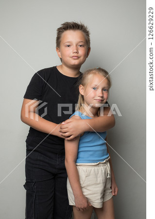 Cheerful brother and sister friendship. Childhood and happiness Cheerful brother and sister friendship. Childhood and happiness 126629229