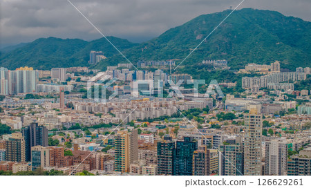 Buildings Surrounded by Lush Greenery and Mountains Buildings Surrounded by Lush Greenery and Mountains 126629261