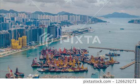 Vibrant Harbor and Skyline View in Busy Urban Waterfront Area Vibrant Harbor and Skyline View in Busy Urban Waterfront Area 126629271