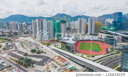 View of a Modern Stadium with Green Field and Tracks 126629339