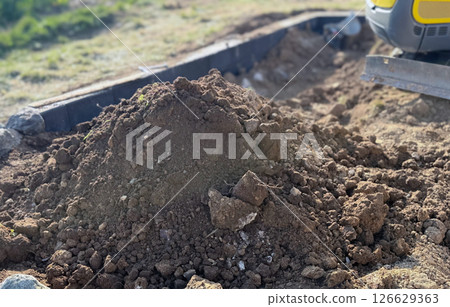 use a spade,mix manure with paddy and soil,Natural fertilizer 126629363