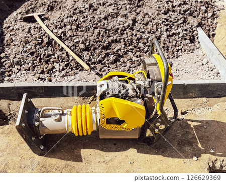 Small plate compactor, vibratory hammer, jumping jack machine, power tool at construction site Small plate compactor, vibratory hammer, jumping jack machine, power tool at construction site 126629369