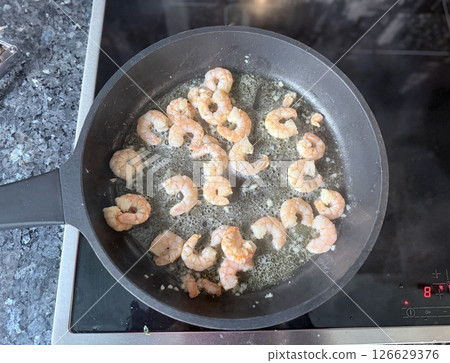 fried roasted shrimps in plate with lemon greens parsley garlic fried roasted shrimps in plate with lemon greens parsley garlic 126629376