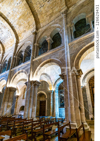 Coimbra , Portugal - Mar 14, 2025: Interior of the Old Cathedral of Coimbra, Se Velha at Coimbra, Portugal. Coimbra , Portugal - Mar 14, 2025: Interior of the Old Cathedral of Coimbra, Se Velha at Coimbra, Portugal. 126629431