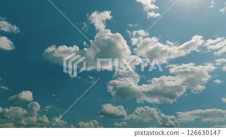 A Beautifully Cloudy Sky Featuring a Bright and Blue Background for a Perfect Day Time lapse. A Beautifully Cloudy Sky Featuring a Bright and Blue Background for a Perfect Day Time lapse. 126630147