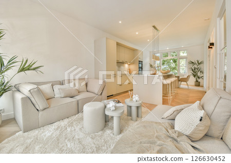 Bright and spacious living room featuring modern furniture, light tones, and an inviting atmosphere, perfect for relaxation and socializing. Bright and spacious living room featuring modern furniture, light tones, and an inviting atmosphere, perfect for relaxation and socializing. 126630452