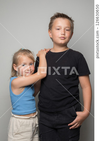 Confident brother and pretty sister friendship. Childhood and  happiness 126630650