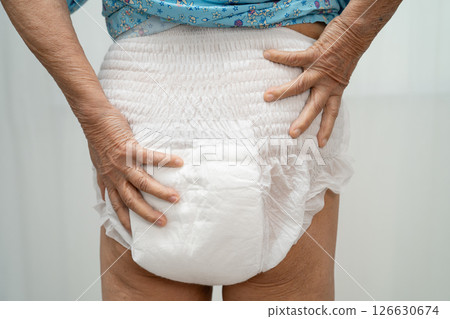 Asian senior woman patient wearing incontinence diaper. Asian senior woman patient wearing incontinence diaper. 126630674