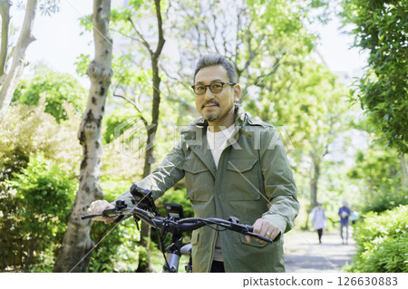 Portrait of a middle-aged man with an electric bicycle 126630883