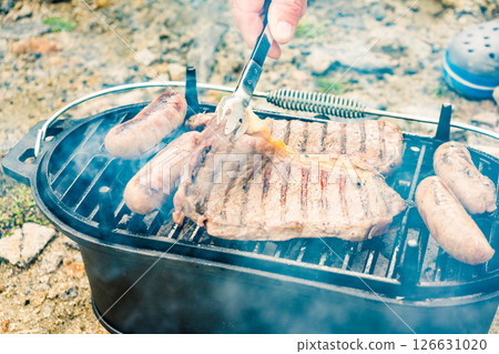 Grilled meat on barbecue grill 126631020