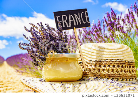 Jar with honey at lavender field. Holidays in France. Jar with honey at lavender field. Holidays in France. 126631071