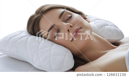 A woman is peacefully sleeping on a contoured ergonomic white pillow with a quilted texture 126631130