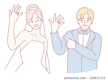 An Elegant Wedding Couple Happily Showcasing Their Beautiful Rings with Joy and Love 126631151