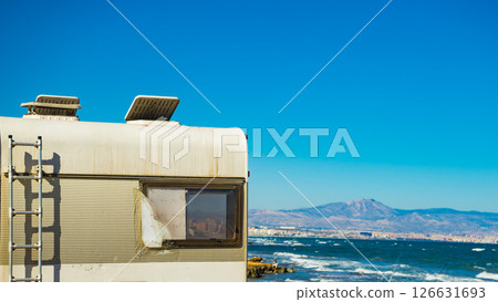 Camper with ladder and broken window 126631693