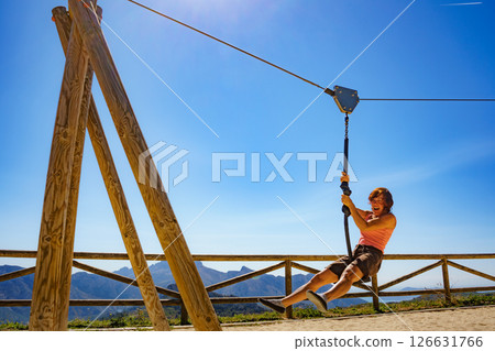 Adult woman having fun on zipline 126631766