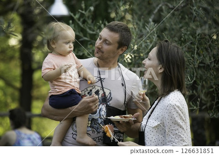 Family Enjoying Outdoor Snack Time Family Enjoying Outdoor Snack Time 126631851