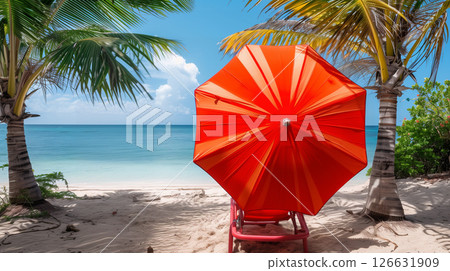 Sun chair under bright red umbrella on an empty tropical beach with white sand and palm trees 126631909