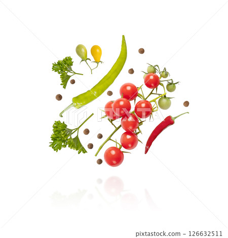 Flying tomatoes, parsley, black pepper and hot pepper isolated on a white background. Set for salad preparation, healthy snacks. Design element for product label Flying tomatoes, parsley, black pepper and hot pepper isolated on a white background. Set for salad preparation, healthy snacks. Design element for product label 126632511