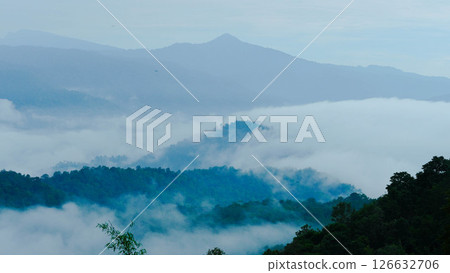 Aerial view of fog flowing over a mountain landscape in northern Thailand. Aerial view of beautiful mountains and clouds with fog. Aerial view of fog flowing over a mountain landscape in northern Thailand. Aerial view of beautiful mountains and clouds with fog. 126632706