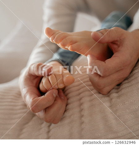 baby feet, boy feet, foot massage, dad tickles son's feet, foot tickling . High quality photo baby feet, boy feet, foot massage, dad tickles son's feet, foot tickling . High quality photo 126632946