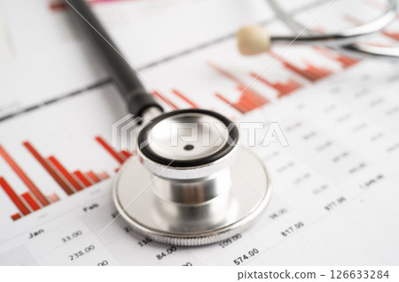 Stethoscope on chart paper, Financial, account, statistics and business data medical health. Stethoscope on chart paper, Financial, account, statistics and business data medical health. 126633284