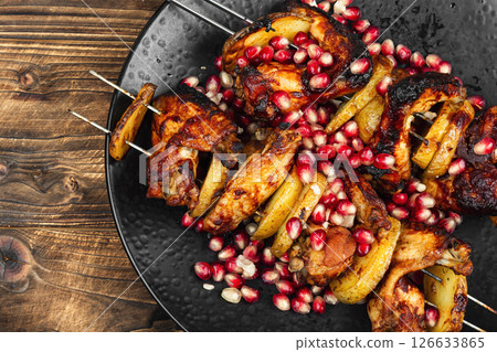 Marinated and grilled chicken wing, skewer. Marinated and grilled chicken wing, skewer. 126633865