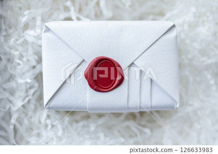 Wax seal stamp on white paper wrap packaging parcel box 126633983