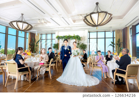 Wedding image: Bride and groom and reception hall 126634216