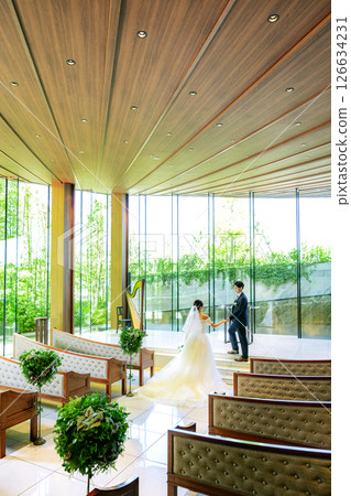 Bride and groom standing in the chapel 126634231