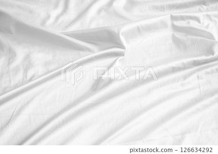 Abstract white wrinkled bedding sheet fabric texture background Abstract white wrinkled bedding sheet fabric texture background 126634292