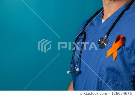Medical professional wearing scrubs and an orange awareness ribbon 126634676