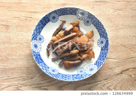 fried crispy salty fermenting beef fat meat with pepper on plate fried crispy salty fermenting beef fat meat with pepper on plate 126634999