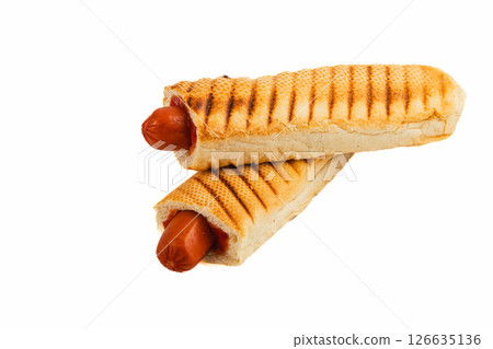Grilled hot dogs served in toasted bread rolls 126635136