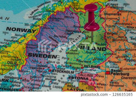 Finland marked on a map with a pushpin in focus Finland marked on a map with a pushpin in focus 126635165