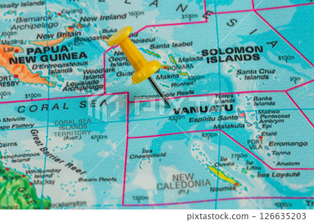 Vanuatu marked on a world map with a yellow pushpin Vanuatu marked on a world map with a yellow pushpin 126635203