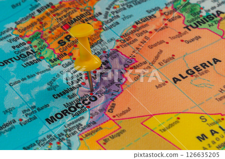 Pinpointing a location on a map of Morocco in North Africa Pinpointing a location on a map of Morocco in North Africa 126635205