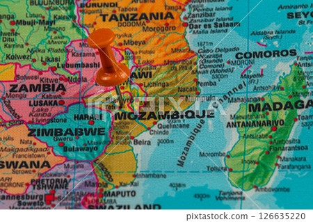 Pin marking location in Mozambique on a colorful map 126635220