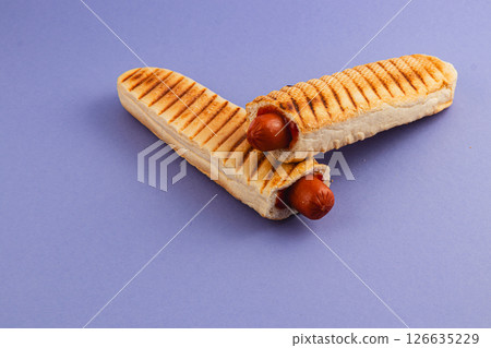 Interesting food creation featuring grilled hot dogs 126635229