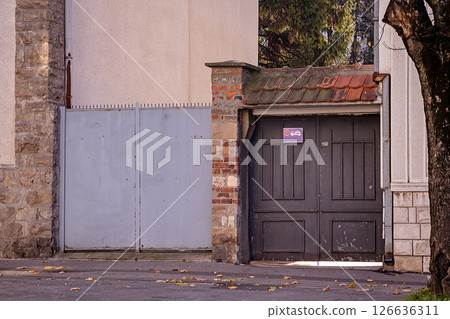 Closed entrance gate of residential house Closed entrance gate of residential house 126636311