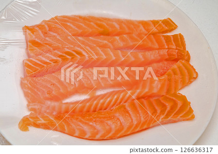 Fresh raw salmon strips 126636317