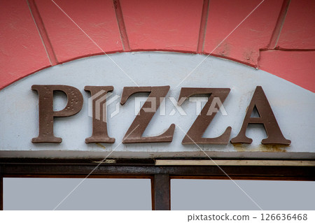Pizza sign on building wall facade Pizza sign on building wall facade 126636468