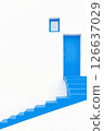 white wall and blue door. Beautiful Mediterranean style Minimalistic light background 126637029
