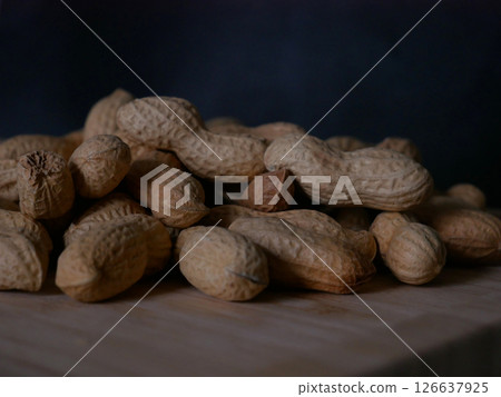 A pile of dried peanuts in shell close up. Healthy protein food 126637925