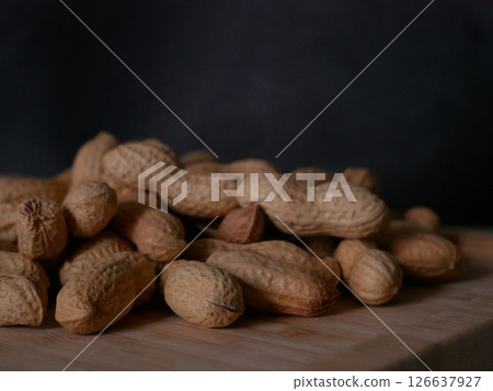 A pile of dried peanuts in shell close up. Healthy protein food 126637927
