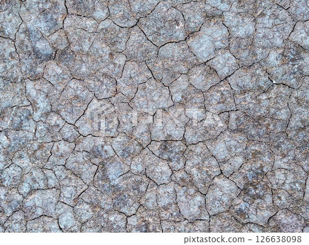 Texture decorative background, natural pattern. Cracked dry soil on a salt lake Igroviotopos Alikis in Marmari, Kos island Greece Texture decorative background, natural pattern. Cracked dry soil on a salt lake Igroviotopos Alikis in Marmari, Kos island Greece 126638098