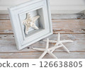 Starfish and wooden frame on a desk Summer image 2 126638805