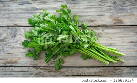 Fresh celery bunch on rustic wooden table. concept of organic produce, healthy lifestyle, nutritious greens 126639154