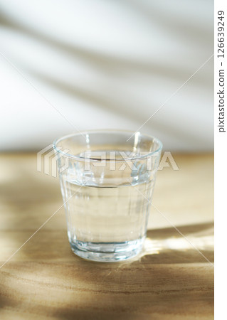 Cold water on a table in the sun 126639249