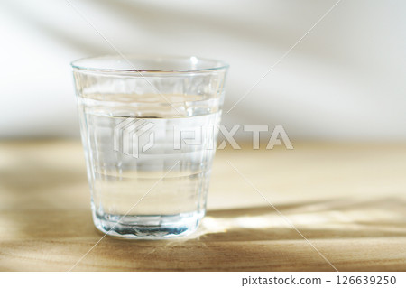 Cold water on a table in the sun 126639250